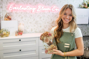 Bride holding a personalized resin keepsake made from her bouquet