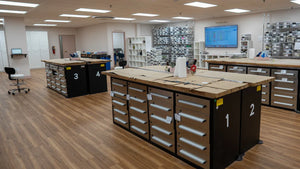 Inside the Everlasting Bloom Co. studio in St. Louis, featuring organized workstations where wedding bouquets are hand-preserved in resin.