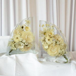 Handmade resin bookends showcasing preserved cream and white wedding blooms in a contemporary curved shape — floral keepsake by Everlasting Bloom Co.