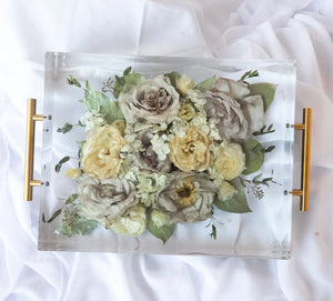 Rectangular resin tray with preserved yellow and neutral wedding flowers, paired with gold handles and styled on soft white fabric — floral preservation by Everlasting Bloom Co.