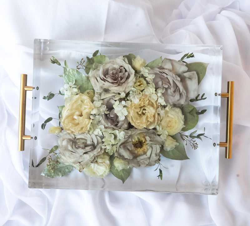 Rectangular resin tray with preserved yellow and neutral wedding flowers, paired with gold handles and styled on soft white fabric — floral preservation by Everlasting Bloom Co.