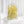 Large arch with a cascade of yellow calla lilies from a wedding bouquet