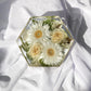 Top-down view of hexagon resin mold showcasing preserved wedding bouquet flowers.