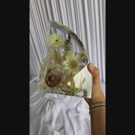 Resin bookends created with real wedding flowers, displayed as a finished keepsake set.