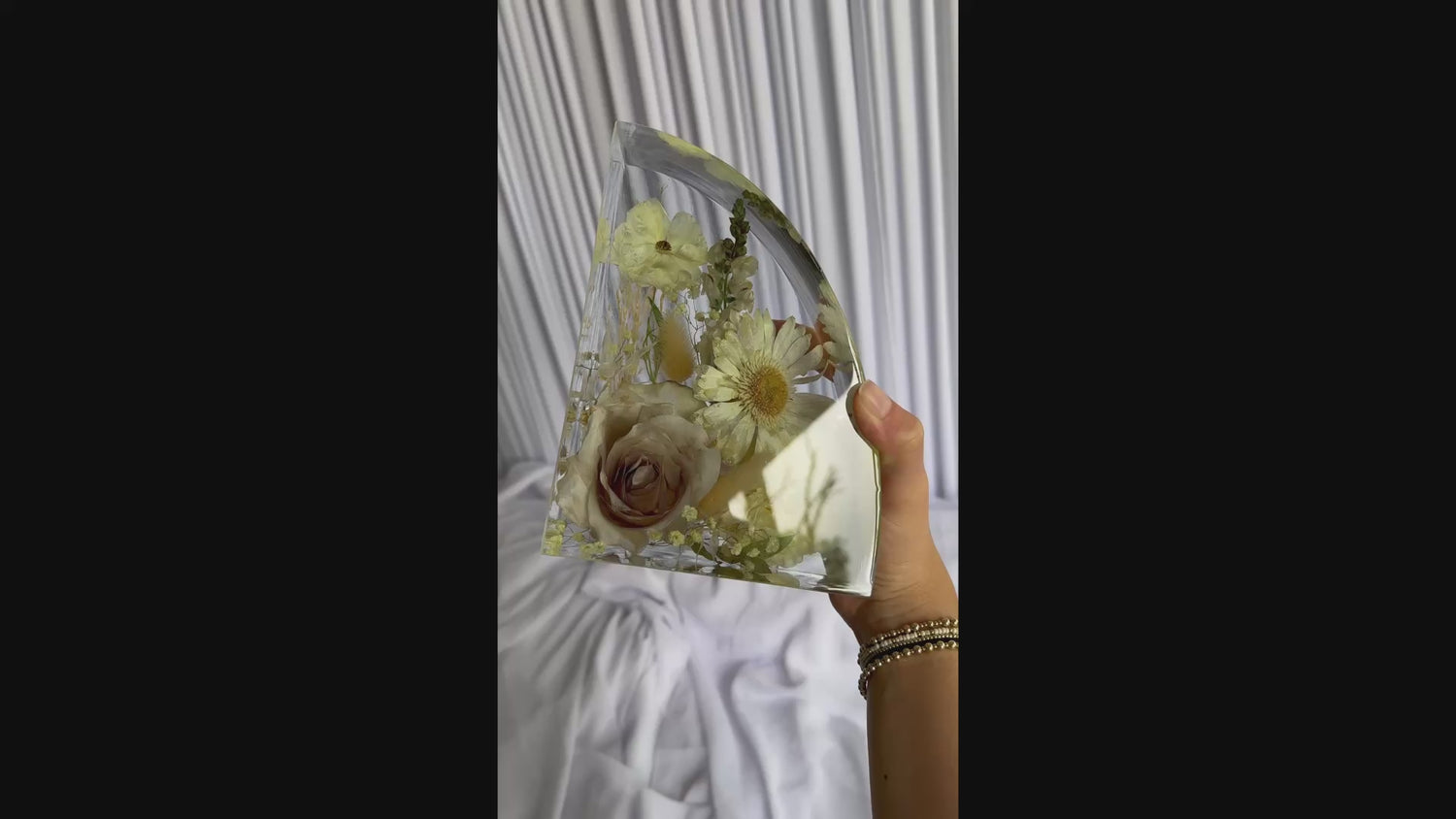 Resin bookends created with real wedding flowers, displayed as a finished keepsake set.