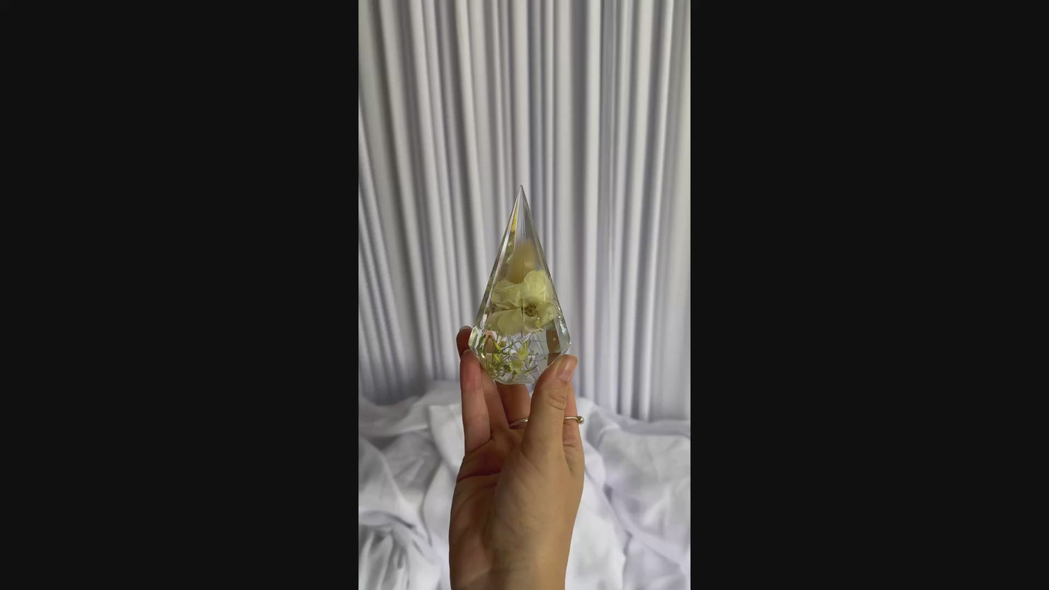 Close-up video of preserved wedding flowers in a resin ring holder keepsake by Everlasting Bloom Co.