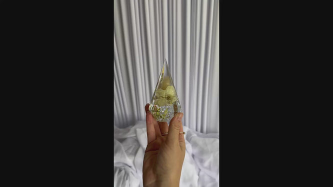 Close-up video of preserved wedding flowers in a resin ring holder keepsake by Everlasting Bloom Co.