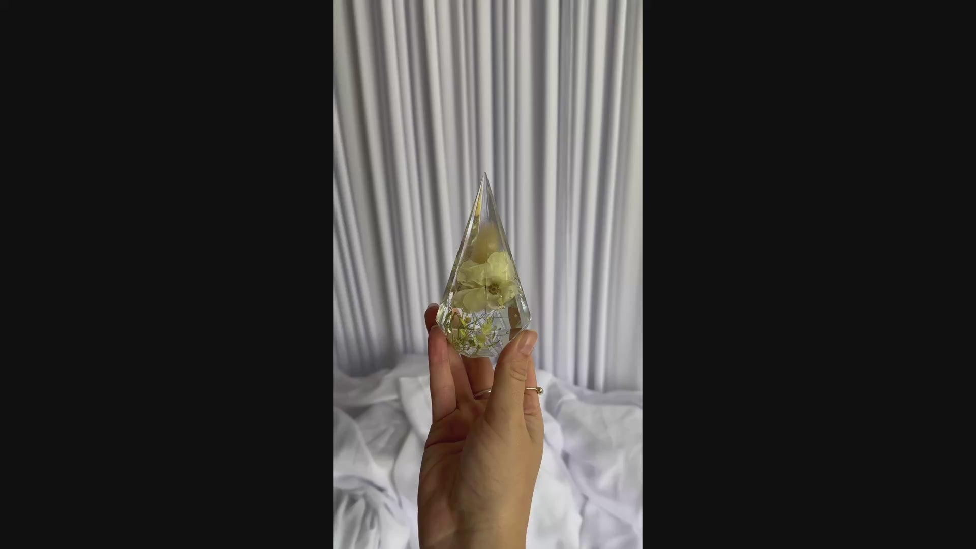 Close-up video of preserved wedding flowers in a resin ring holder keepsake by Everlasting Bloom Co.