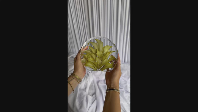 Short video of a small standing circle resin keepsake made from preserved wedding blooms.