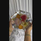 8-second video showcasing a hexagon-shaped resin keepsake made from real wedding flowers.