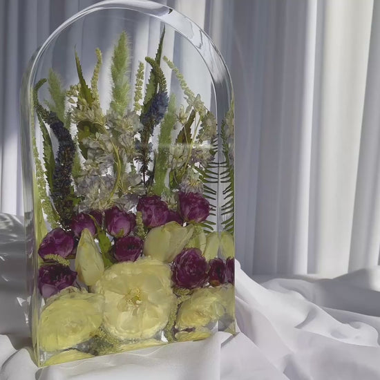 Video of large arch resin mold showcasing preserved wedding flowers with yellow roses, purple ranunculus, and greenery — handmade keepsake by Everlasting Bloom Co