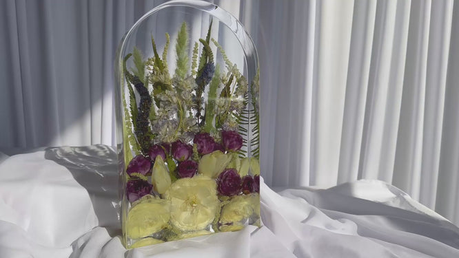 Video of large arch resin mold showcasing preserved wedding flowers with yellow roses, purple ranunculus, and greenery — handmade keepsake by Everlasting Bloom Co