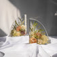 Matching set of resin bookends with preserved wedding flowers arranged in clear epoxy.