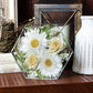 Hexagon flower preservation keepsake styled on a shelf with soft decorative lighting