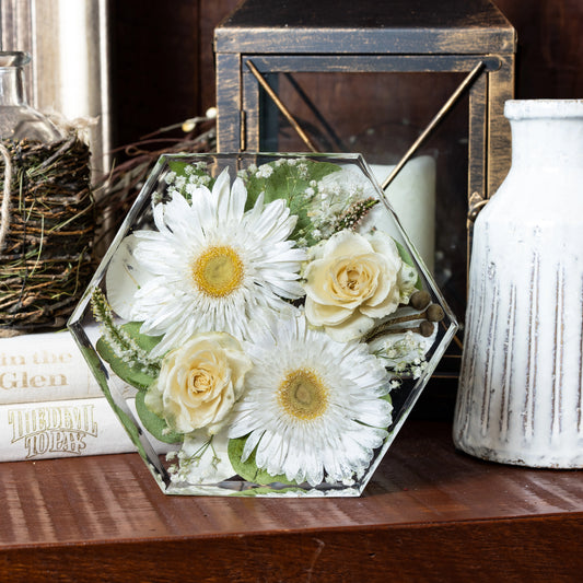 Hexagon flower preservation keepsake styled on a shelf with soft decorative lighting