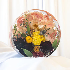 Standing floral circle resin keepsake with preserved blush peony, yellow craspedia, burgundy roses, and wildflowers — wedding bouquet preservation by Everlasting Bloom Co.