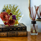 Bright, colorful floral resin keepsake in a hexagon shape styled on a dresser.
